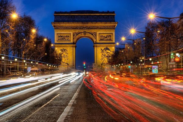 Traffic passes the Arch de Triumph on the Champs Elysee in Paris-France